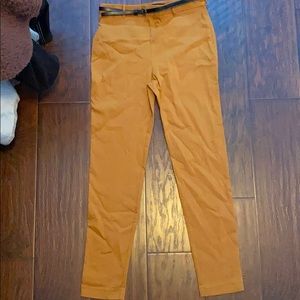 yellow pants with a black belt